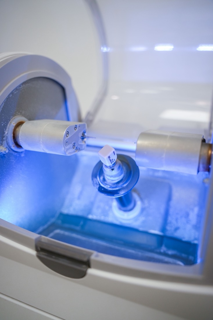 Porcelain veneer being milled in the in-house CEREC unit at Melrose Dental Studio