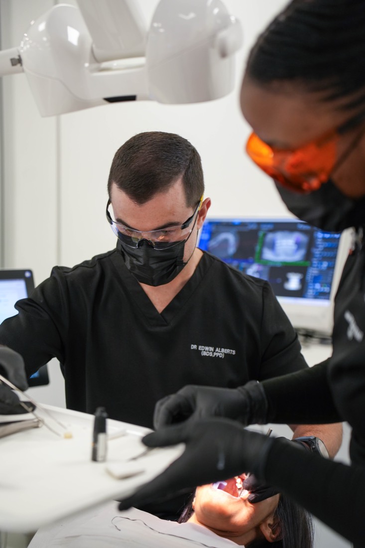 Dr Alberts working with digital dentistry equipment