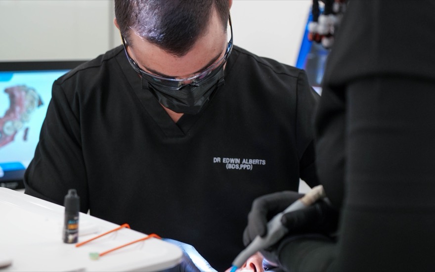 Dr Edwin Alberts placing a metal-free ceramic filling for a patient at Melrose Dental Studio
