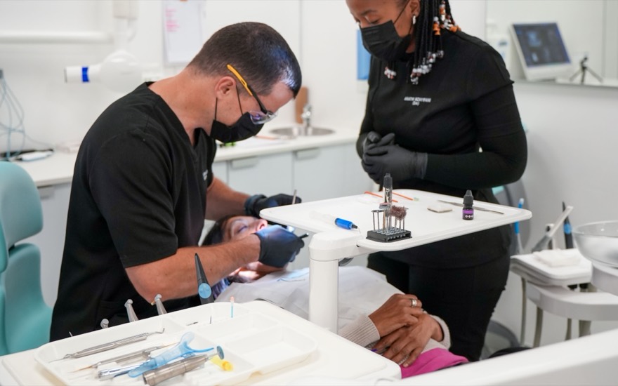 Dr Edwin Alberts treating a patient chairside at Melrose Dental Studio